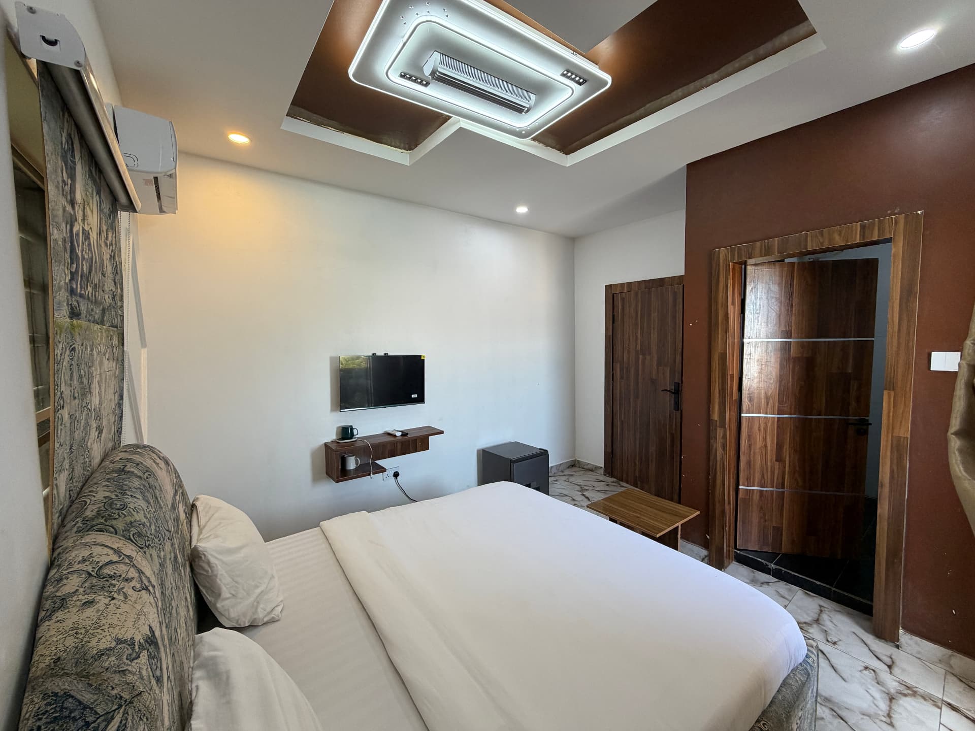 The bed and the tapestry headboard - Signature Seaview at Timeless Haven & Cottage, photo 1 of 4